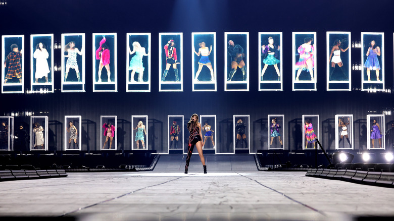 Taylor Swift in front of glass boxes