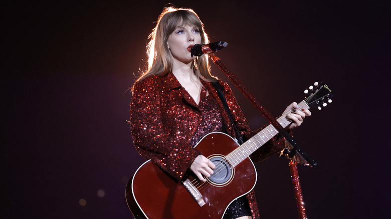 Taylor Swift with a red guitar