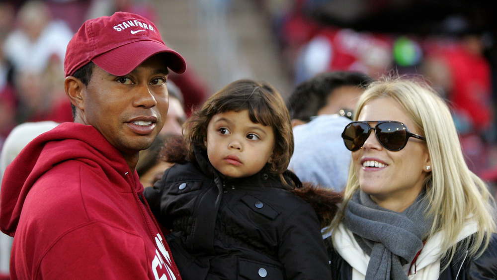 Tiger Woods ed Elin Nordegren con la loro figlia a un evento